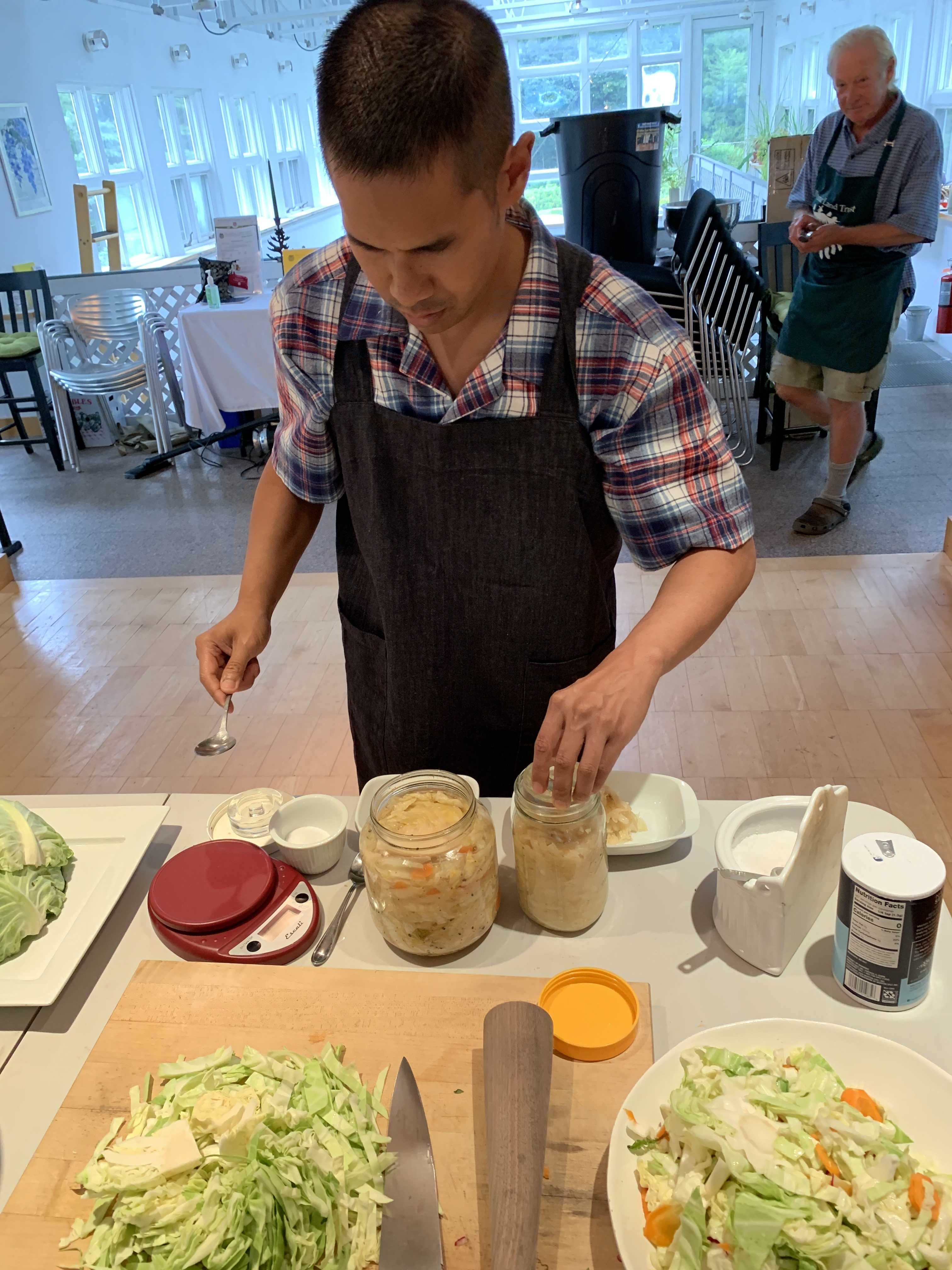 Community Gardener Justin Ruaysamran is making sauerkraut