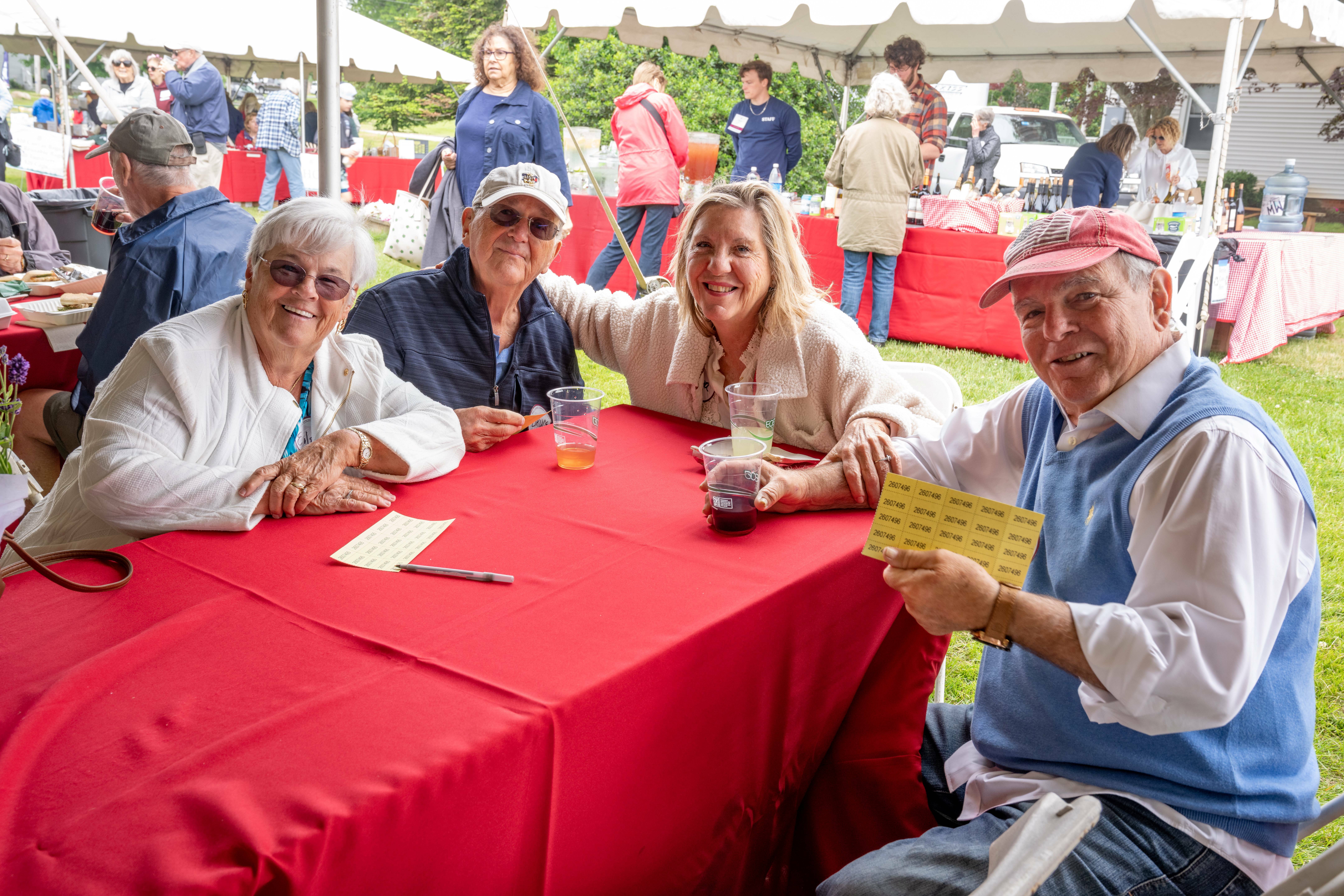 Peconinic Attendees under the tent