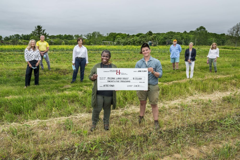 Layton Guenther, Quail Hill Farm Director receives AFTEE grant in the farm fields