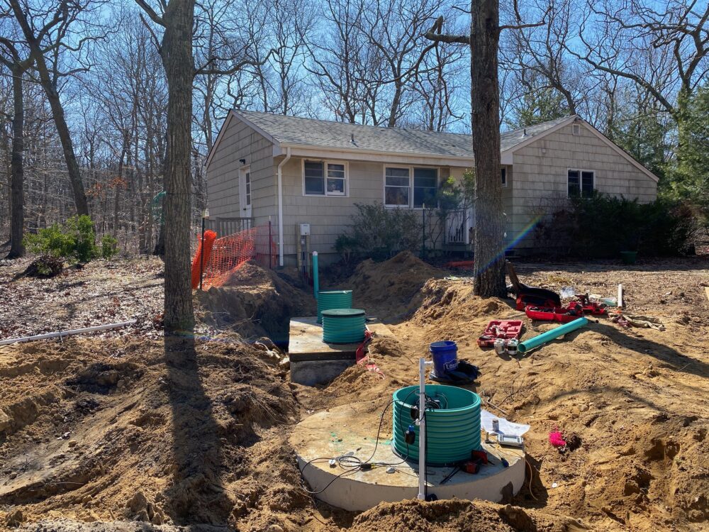 new septic system with the house in the background
