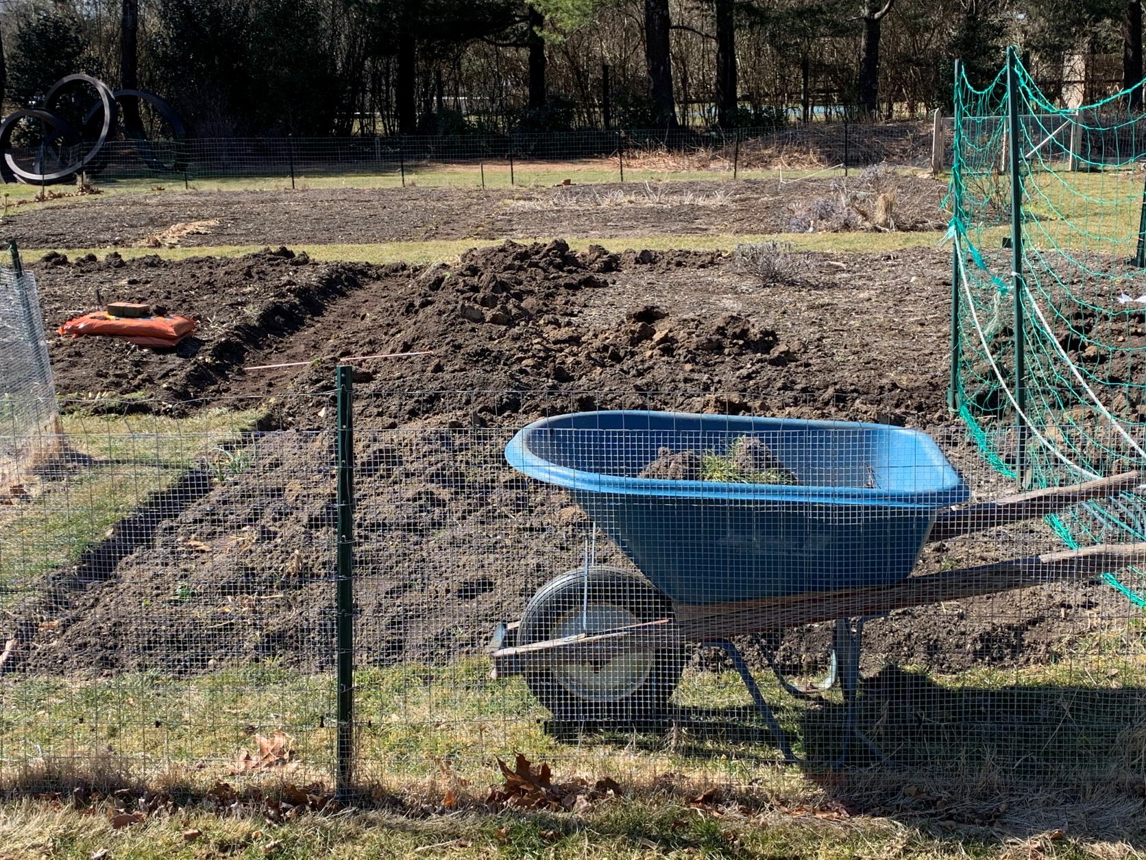 Community garden plots getting freshly mulched paths
